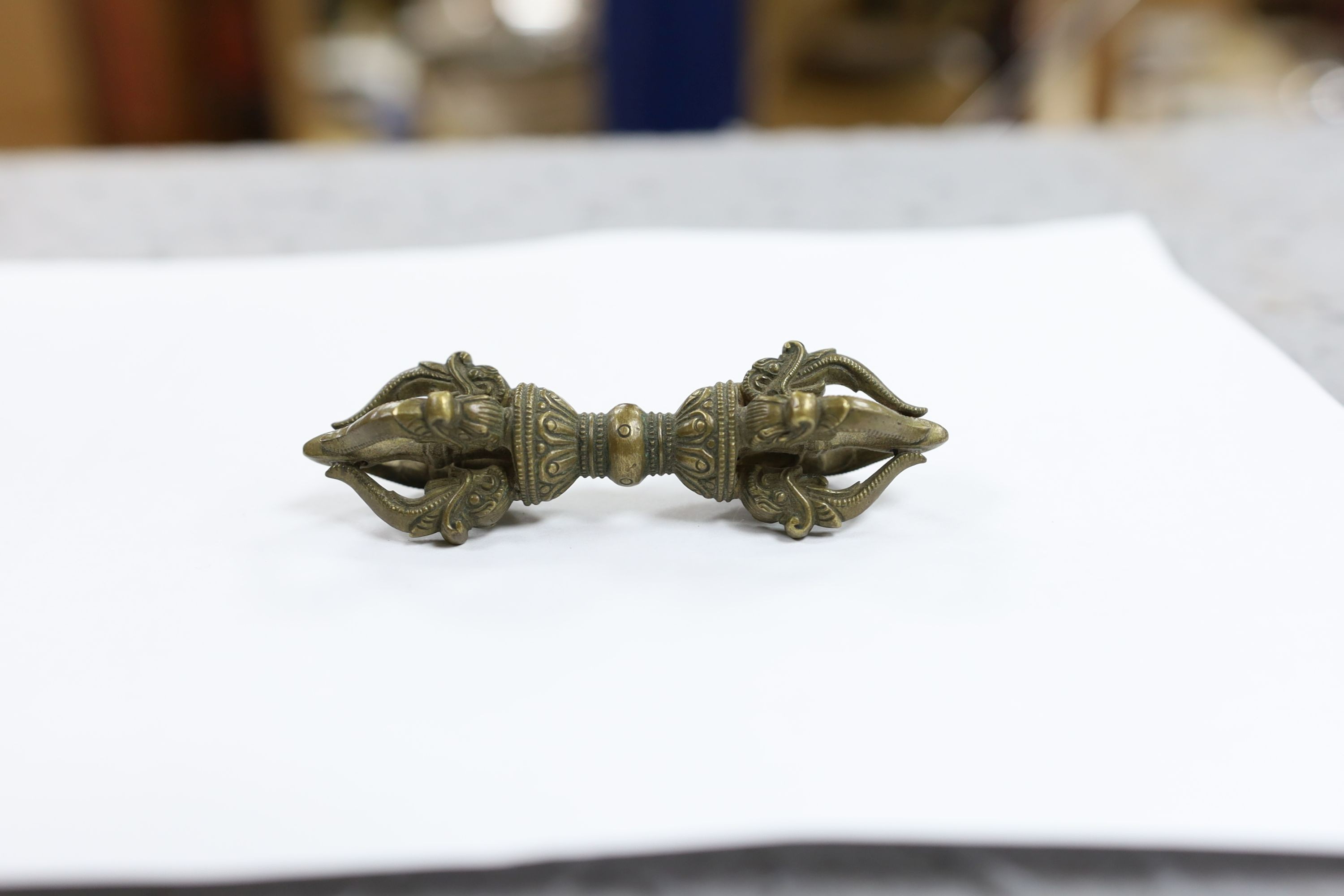 Five Chinese or Tibetan bronze figures or Buddhist implements, tallest 13cms high